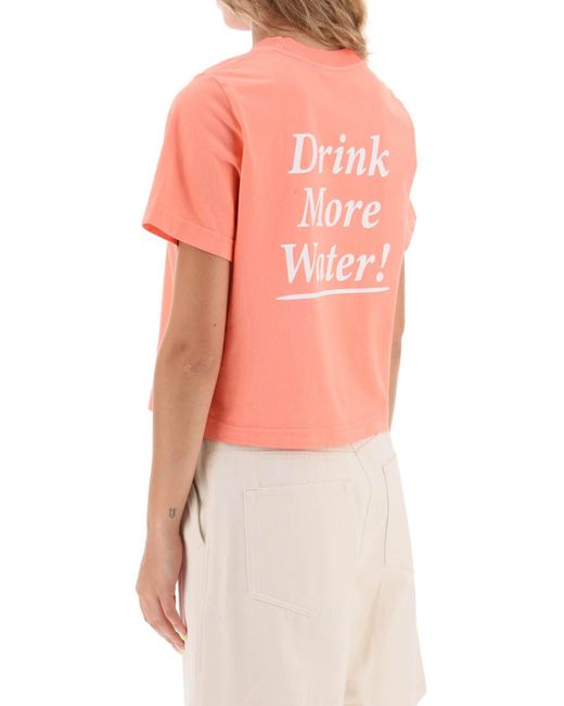 Sportliches und reiches "Drink More Water" T -Shirt Sporty & Rich de color Pink