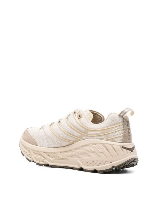 U Stinson Evo og Hoka One One de hombre de color Natural