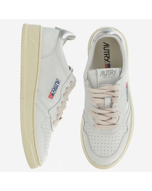 Autry White Leather Trainers With Front Lacing And Metallic Heel Tab