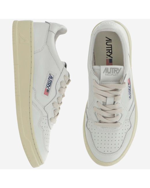 Autry White Low-Top Leather Sneakers With Perforated Round Toe And Logo Detailing