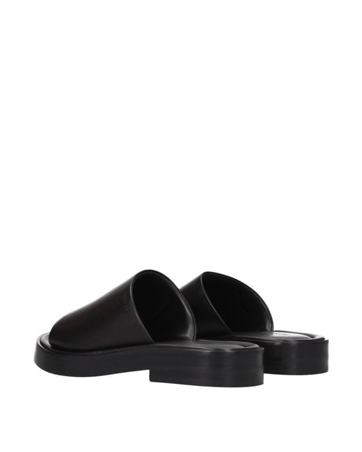 Ferragamo Black Leather Slides And Clogs