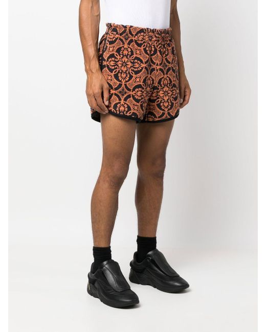 MARINE SERRE Orange Printed Running Shorts for men