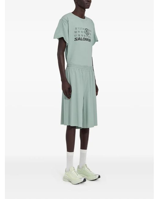 MM6 MAISON MARGIELA X SALOMON Green Mm6 Maison Margiela X Salomon X Salomon Shorts With Numerical Graphics