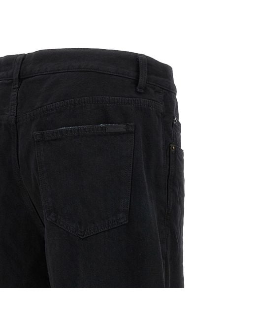 Jeans de mezclilla larga holgada Saint Laurent de hombre de color Black
