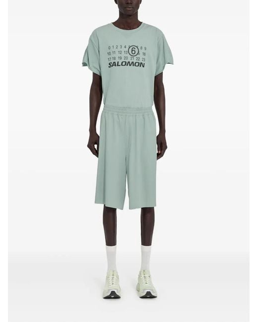 MM6 MAISON MARGIELA X SALOMON Green Mm6 Maison Margiela X Salomon X Salomon Shorts With Numerical Graphics