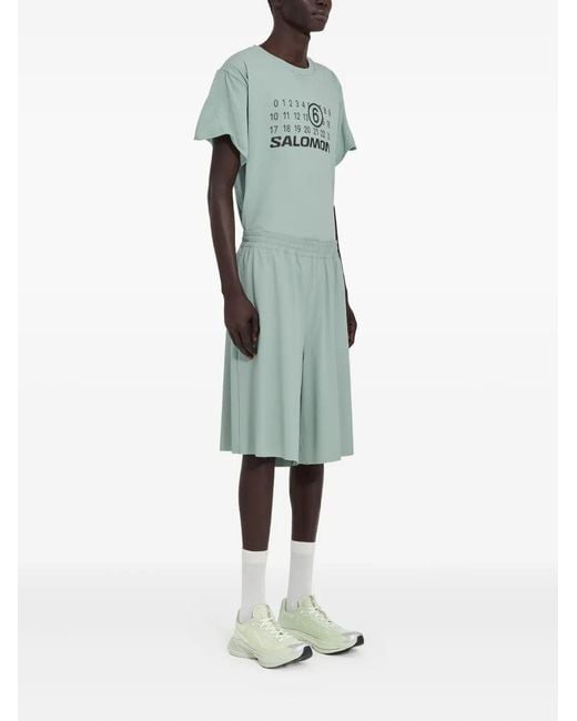 MM6 MAISON MARGIELA X SALOMON Green Mm6 Maison Margiela X Salomon X Salomon Shorts With Numerical Graphics