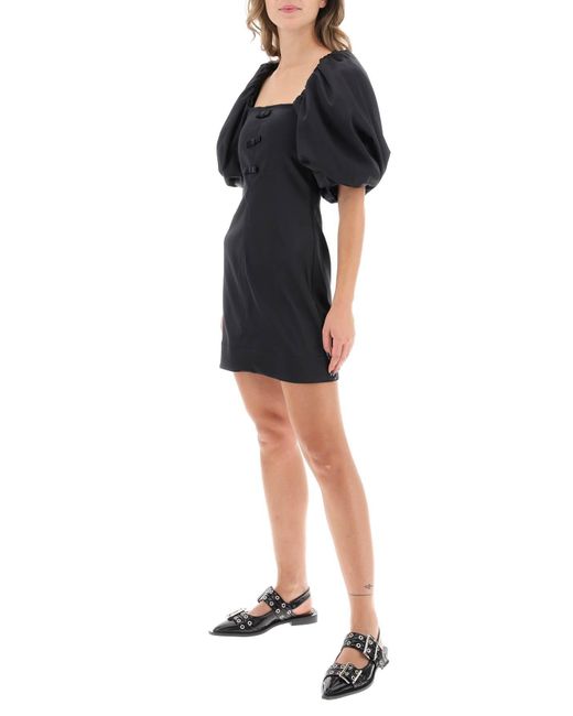 Satin mini robe avec manches de ballon Ganni en coloris Black