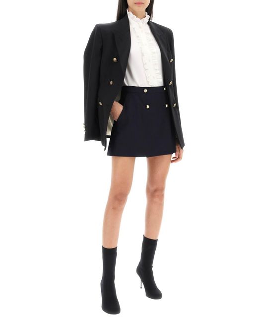 Mini jupe enveloppe avec des boutons de phoque Alexander McQueen en coloris Black