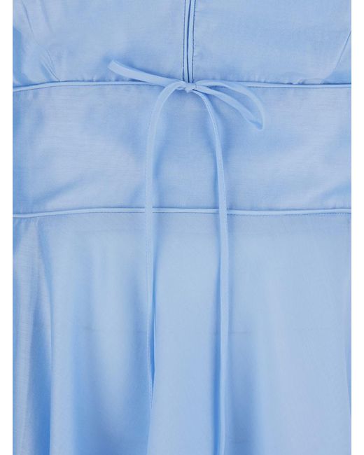 Plain Blue Light Dress With V-Neck And Flared Skirt
