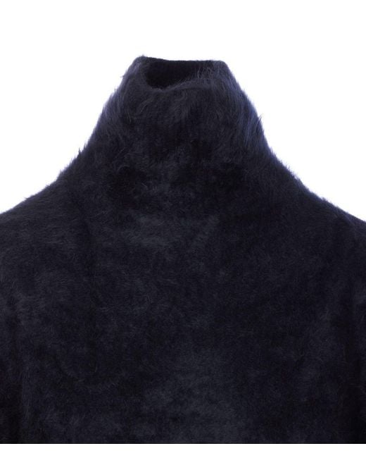 Lisa Yang Blue Sweaters