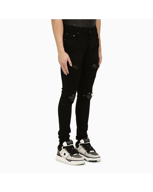 Amiri Black Skinny Jeans With Camouflage Patches for men
