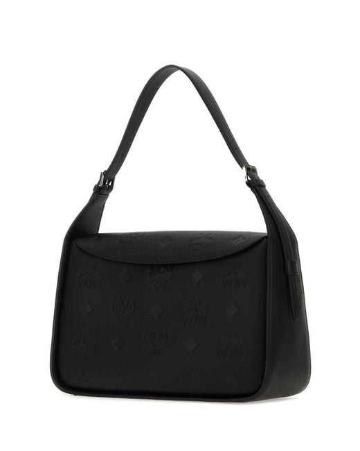 MCM Black Handbags.