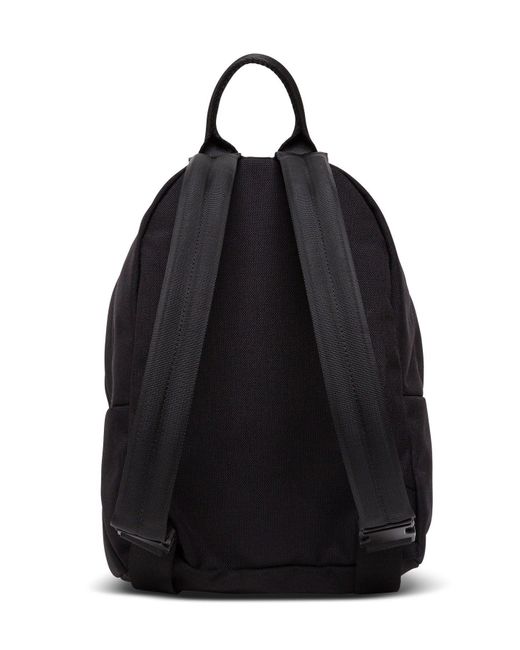 small black canvas backpack