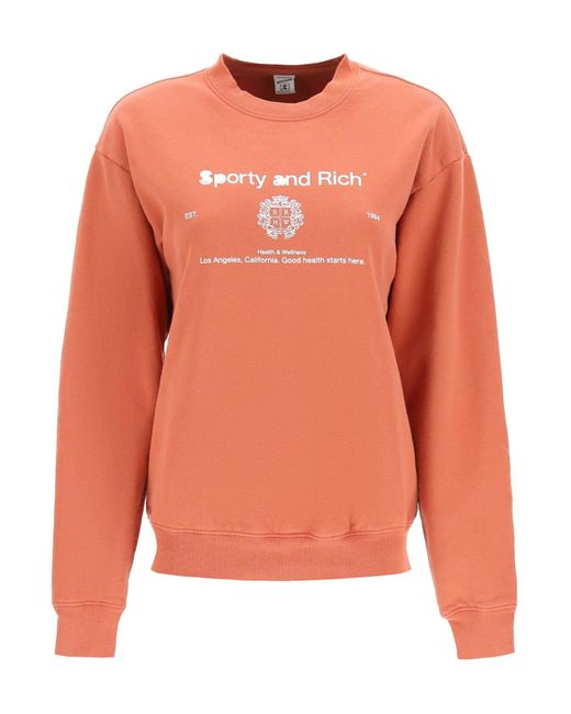 Sporty & Rich Cotton Sporty Rich Crest Crew Neck Sweatshirt in Orange