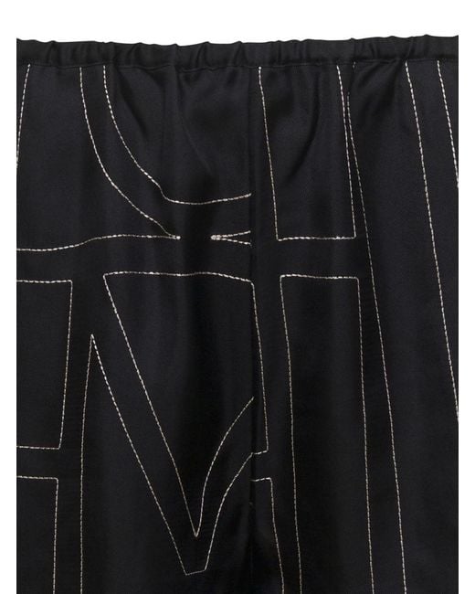 Totême  Black Shorts With Geometric Logo Print