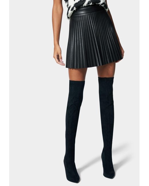 Bebe Pleated Side Zipper Vegan Leather Skirt in Black | Lyst UK