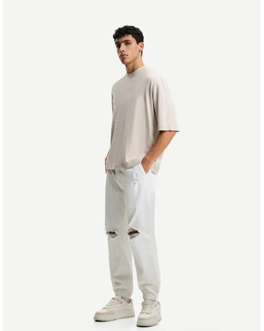 Bershka White Ripped Jogger Jeans for men