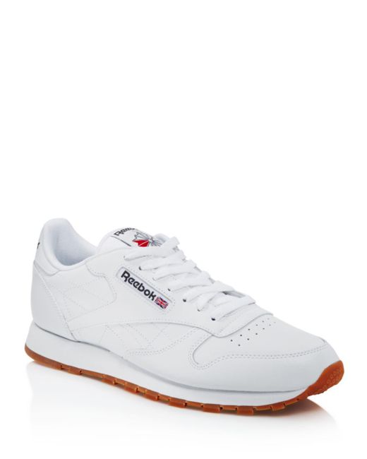 white and tan reebok
