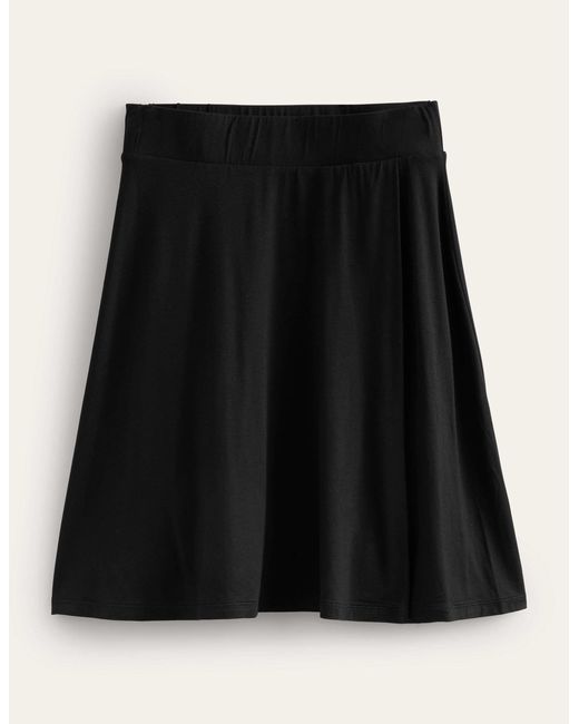 Mini-jupe portefeuille en jersey Boden en coloris Black