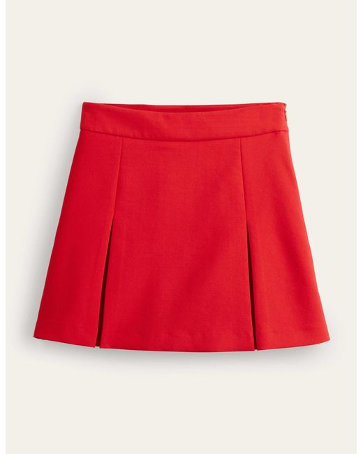 Mini-jupe trapèze plissée Boden en coloris Red