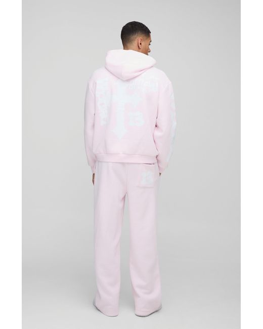 BoohooMAN Kastiger Oversize Trainingsanzug mit Kreuz-Print und Kapuze in Pink für Herren