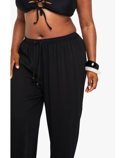 Pantalón Plus Para La Playa De Pernera Ancha Fruncido Con Cuentas Boohoo de color Black