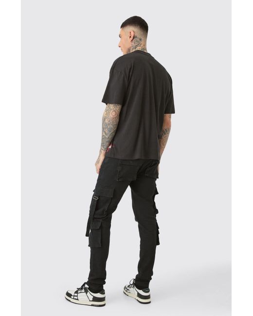 BoohooMAN Tall Stretch Skinny Cargo Pocket Detail Jean In True Black für Herren