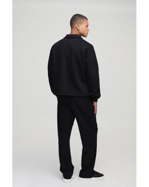 BoohooMAN Jogginghose mit geradem Bein in Waffeloptik und Man-Stickerei in Black für Herren