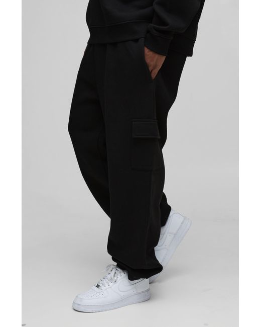 BoohooMAN Plus 330Gmode lockere Basic Cargo-Jogginghose in Black für Herren