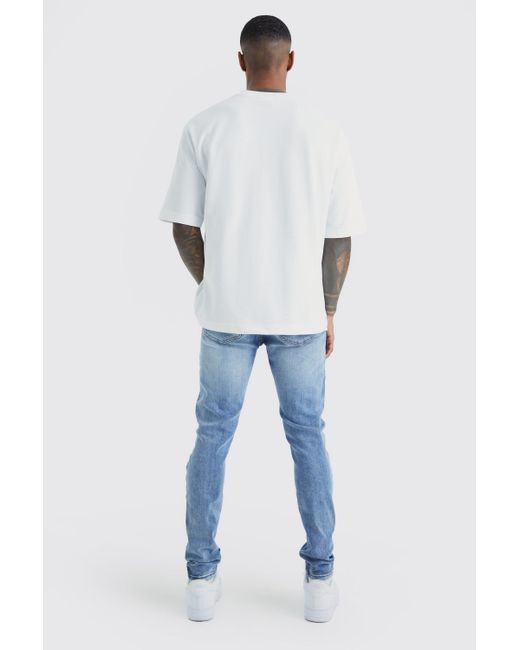 BoohooMAN Blue Skinny Stretch Bleached Ripped Knee Jeans for men
