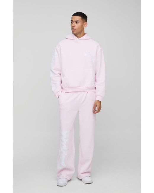 BoohooMAN Kastiger Oversize Trainingsanzug mit Kreuz-Print und Kapuze in Pink für Herren