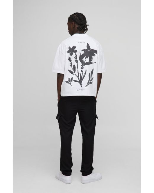 Camiseta Oversize Recta Con Cuello Extendido Y Estampado De Flores Aterciopeladas Boohoo de color Black