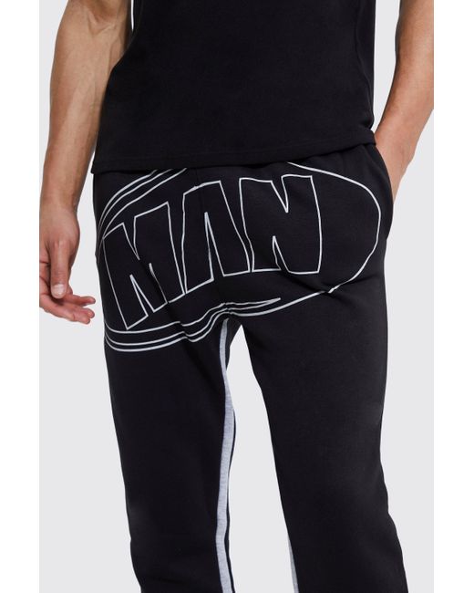 stacked black joggers