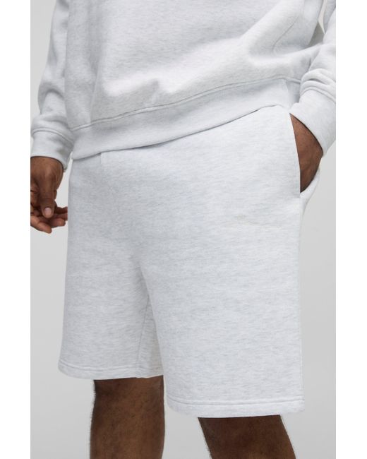 BoohooMAN Plus lockere mittellange BM Signature Shorts in White für Herren