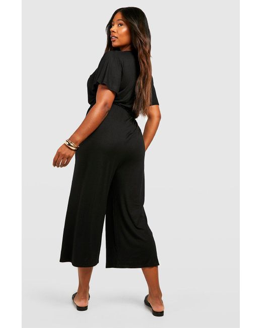 Boohoo Plus Jersey Knit Wrap Belted Culotte Jumpsuit in Black | Lyst Canada