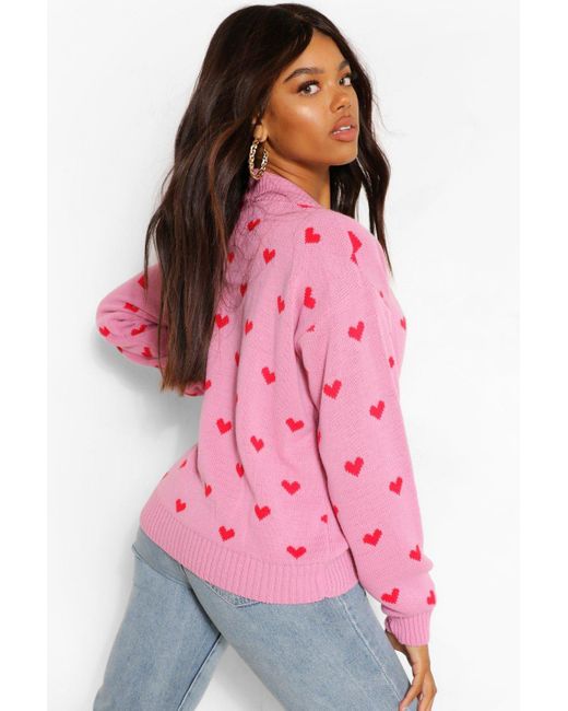 white sweater with pink hearts