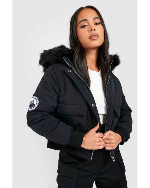 Boohoo Petite Luxe Faux Fur Hood Sporty Cropped Coat in Black | Lyst UK
