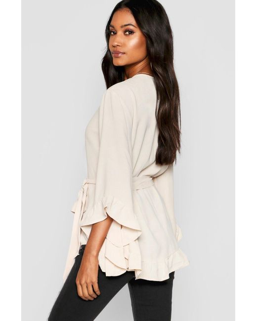 ruffle hem wrap blouse