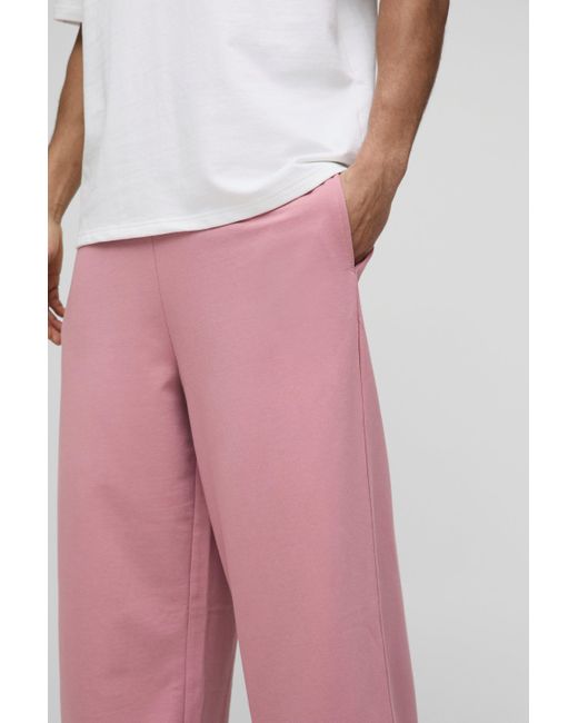 BoohooMAN Basic Jogginghose mit extrem weitem Bein in Pink für Herren