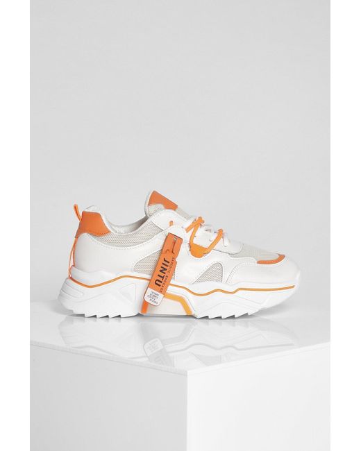 chunky orange sneakers