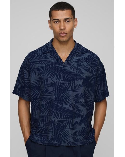 BoohooMAN Kastiges Oversize Poloshirt mit Palmen-Print in Blue für Herren