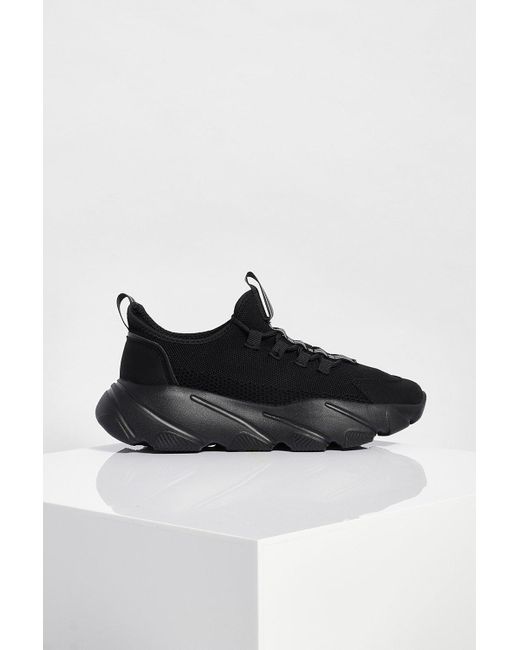 black chunky platform trainers