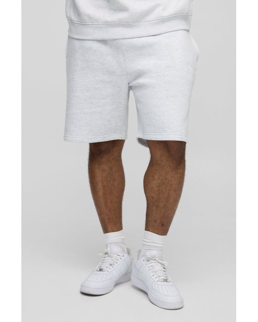 BoohooMAN Plus lockere mittellange BM Signature Shorts in White für Herren