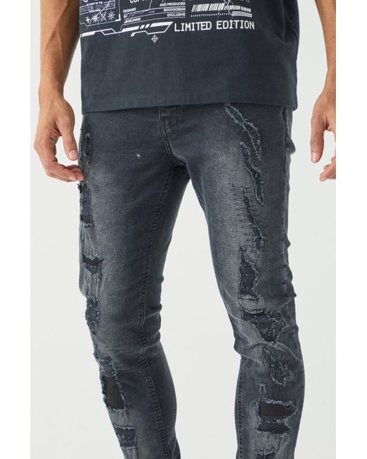 BoohooMAN Skinny Stretch All Over Ripped Black Jeans in Blue für Herren