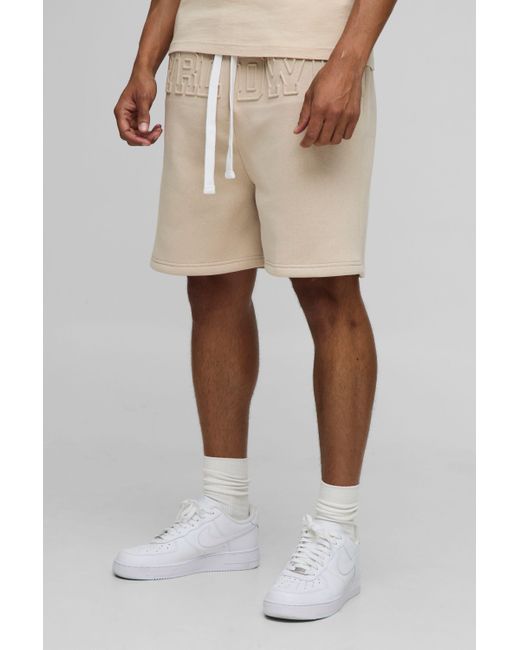 BoohooMAN Natural Oversized Worldwide Embossed Drop Crotch Shorts for men