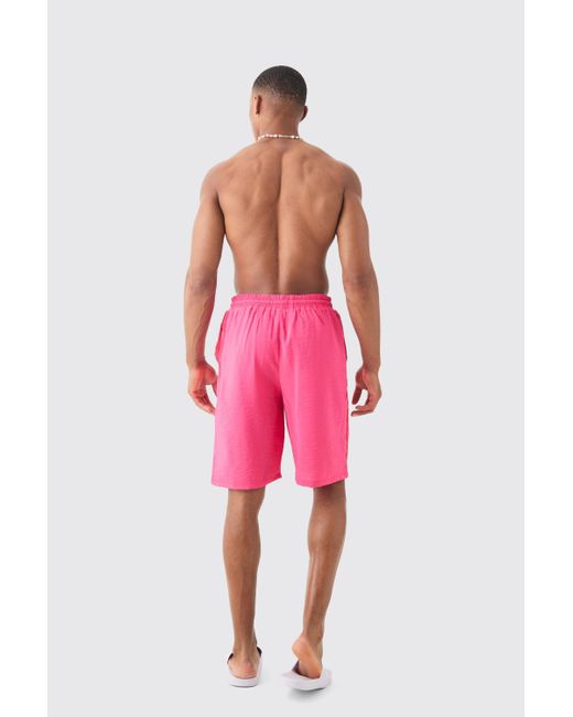 BoohooMAN Pink Triangle Crinkle Board Trunks for men