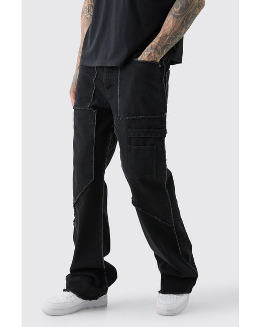 BoohooMAN Tall Fixed Waist Washed Relaxed Raw Edge Twill Flare Trouser in Black für Herren