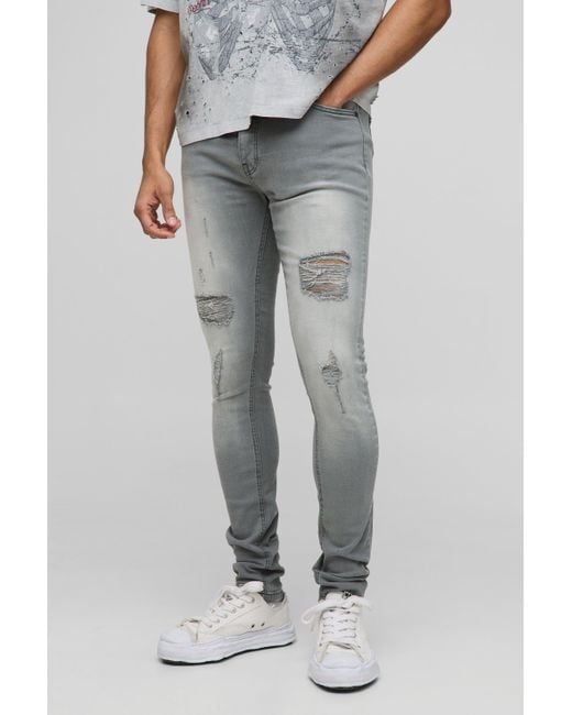 Vaqueros Pitillo Elásticos Rotos Con Bajo Plegado Boohoo de color Gray