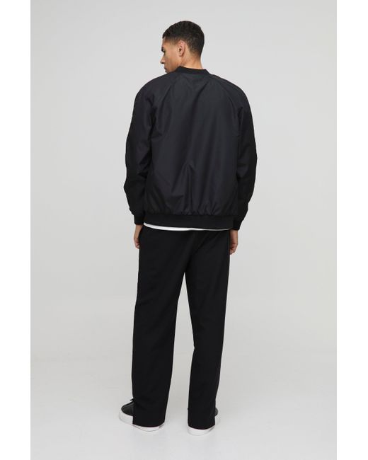 BoohooMAN Black Elasticated Waist Relaxed Fit Technical Stretch Pants for men
