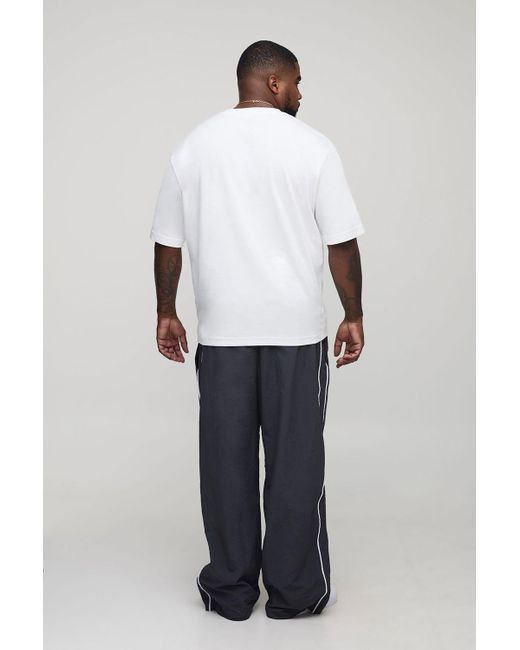 BoohooMAN Black Plus Stripe Embroidered Parachute Pants for men